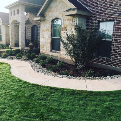 Finished front landscape and lawn by First Choice Lawn and Landscape in the Abilene area